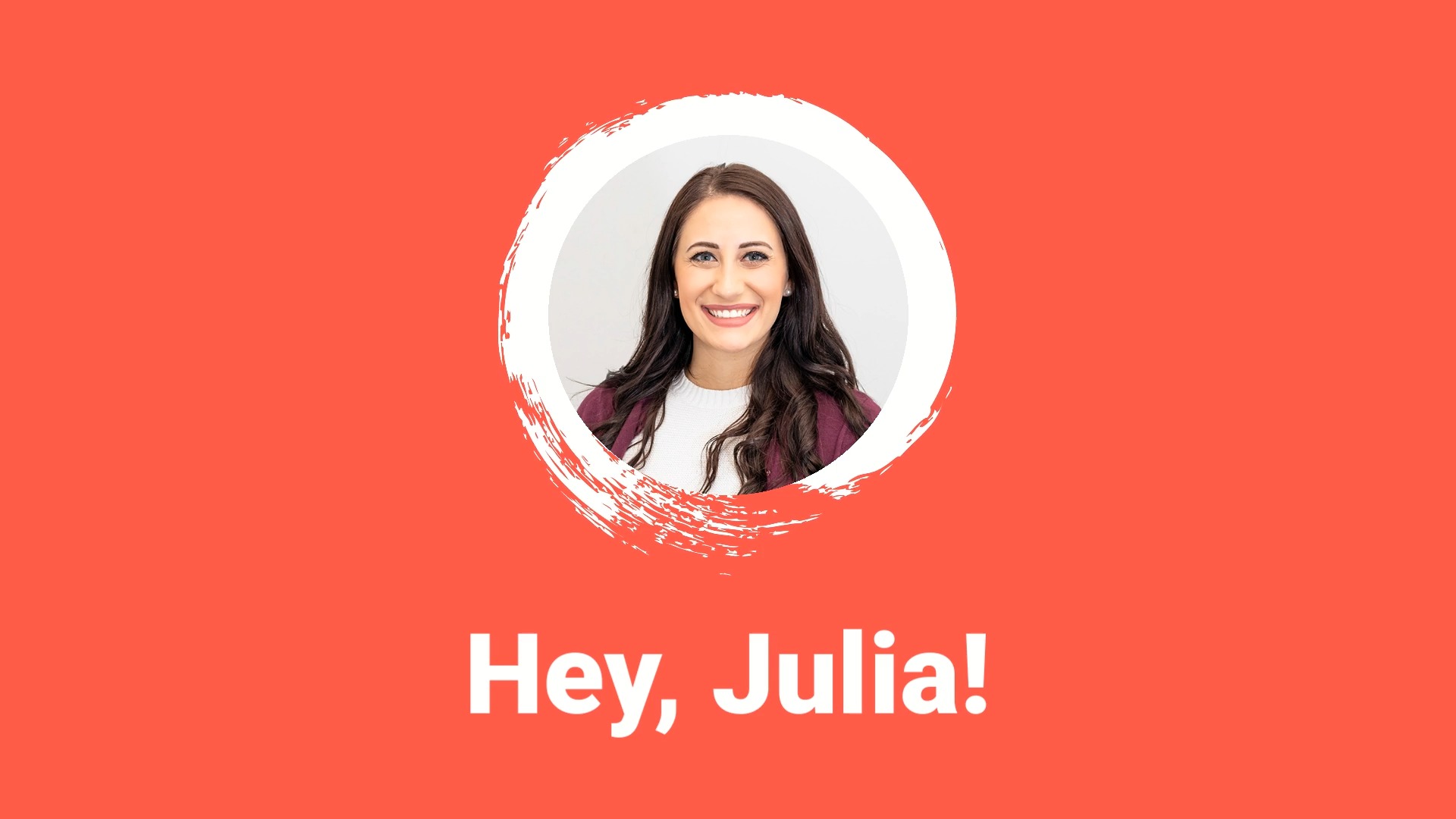 Smiling woman with long dark hair on a red background, framed by a white circle; text reads "hey, Julia!" crafted using Biteable video maker.